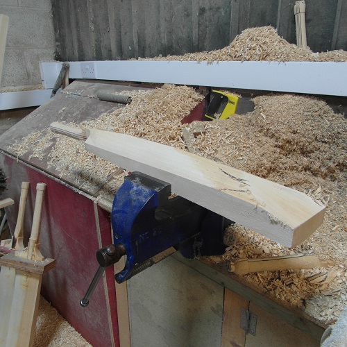 Shaping of the bat to prepare for pressing.